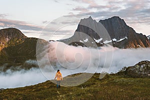 Woman hiking alone in mountains travel adventure lifestyle outdoor in Norway