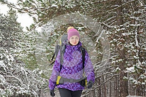 Woman Hiking with Big Backpack in Beautiful Winter Forest