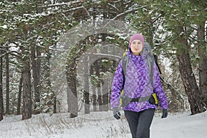 Woman Hiking with Big Backpack in Beautiful Winter Forest