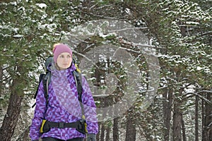 Woman Hiking with Big Backpack in Beautiful Winter Forest