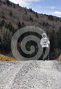 Woman hiking on a country road