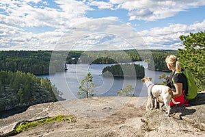 Woman hiking in forest in National Park with dog