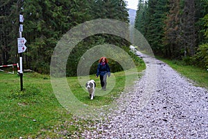 Woman hiking with her dog