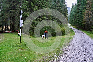 Woman hiking with her dog