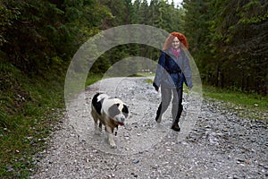 Woman hiking with her dog