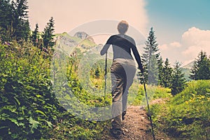 Woman hiking in mountain forest photo