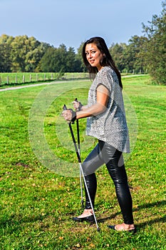 Woman hiking with Nordic Walking sticks
