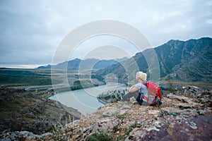 Woman hiking outdoors. Eco Tourism.