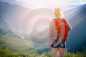 Woman hiking outdoors. Eco Tourism.