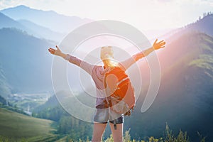 Woman hiking outdoors. Eco Tourism. photo