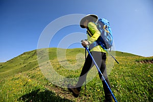 Woman hiking in prairie mountains