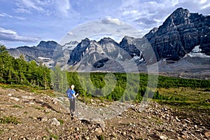 Woman hiking in rocky mountains.