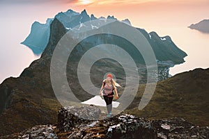 Woman hiking solo in Norway travel outdoor healthy lifestyle active girl with backpack exploring mountains