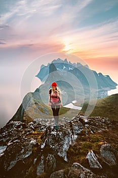 Woman hiking solo traveling in Norway outdoor active summer vacations healthy lifestyle girl hiker with backpack