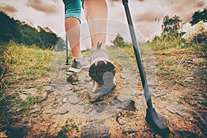 Woman hiking with sticks