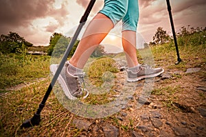 Woman hiking with sticks