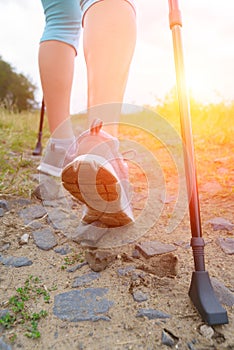 Woman hiking with sticks