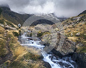 Woman hiking at Tristaina Lakes, Andorra