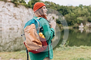 Woman hiking in woods. Adventure women enjoying view of majestic mountain lake explore travel. Freedom and active