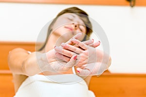 Woman with his eyes closed and stretches