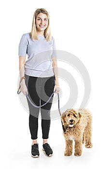 Woman with his Golden Labradoodle dog isolated on white background