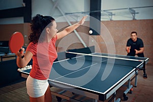 Woman hits the ball, table tennis, ping pong