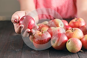 Woman hold Apples on wooden background