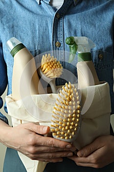 Woman hold bag with eco friendly cleaning products