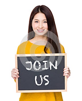 Woman hold blackboard showing a phrase of join us