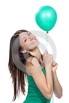 Woman hold green balloon in hands for birthday party
