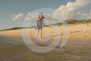 Woman hold hair and walk