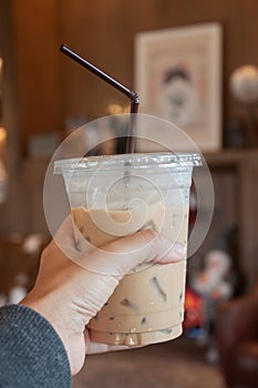 Woman hold her iced coffee