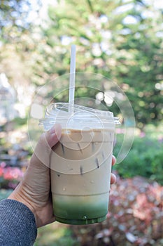 Woman hold her iced coffee