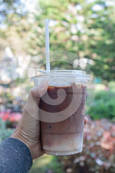 Woman hold her iced coffee