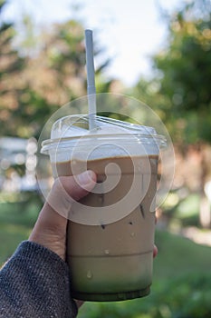 Woman hold her iced coffee