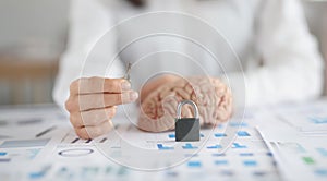 Woman hold key, lock and human brain on desk, symbol as key to someones mind