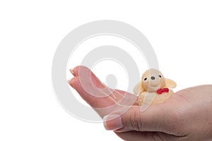 woman hold a little sheep figure in her hand