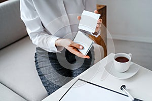 Woman hold metaphorical associative cards.