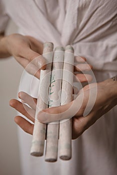 A woman hold Moxa stick.