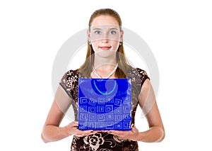 Woman hold on palms blue bag with gift