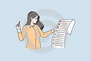 Woman hold paper check completed tasks with mark
