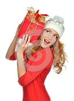 Woman hold red Christmas wrapped gift present smiling