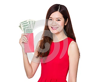 Woman hold red pocket with USD
