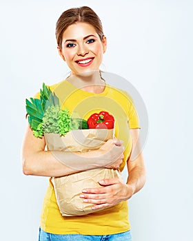 Woman hold shopping bag with green vegan food