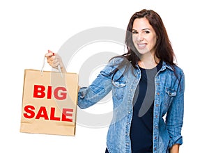 Woman hold with shopping bag for showing big sale