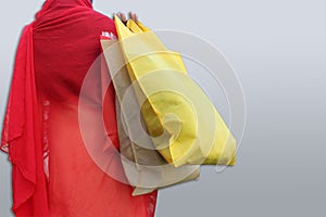 Woman hold shopping bags and smiling on city street. Christmas shopping, winter sale concept