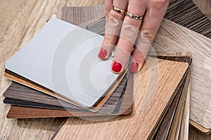 Woman hold wooden color guide