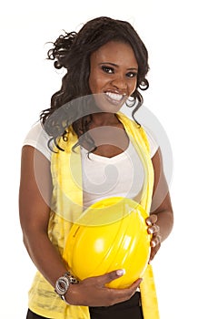 Woman hold yellow hard hat