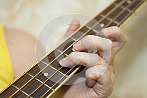 Woman holding an acoustic bass guitar