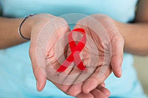 Woman Holding Aids Awareness Ribbon